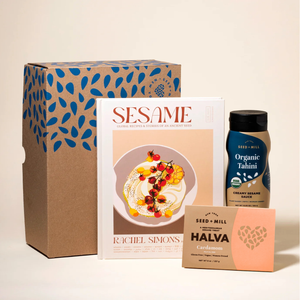 Box with cookbook, tahini, and box of cardamom halva