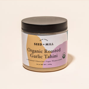 A jar of roasted garlic tahini.